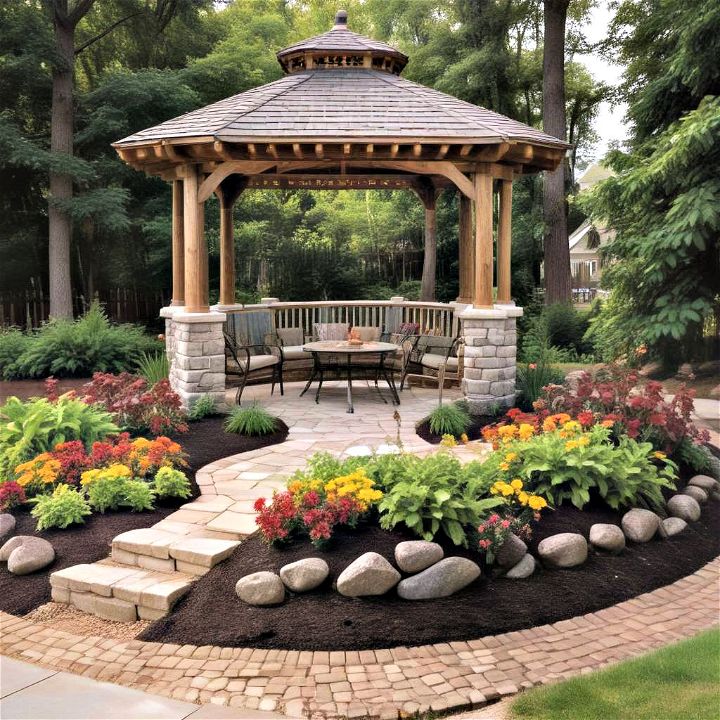 framing a gazebo or pergola with rock foundations and mulch landscaping