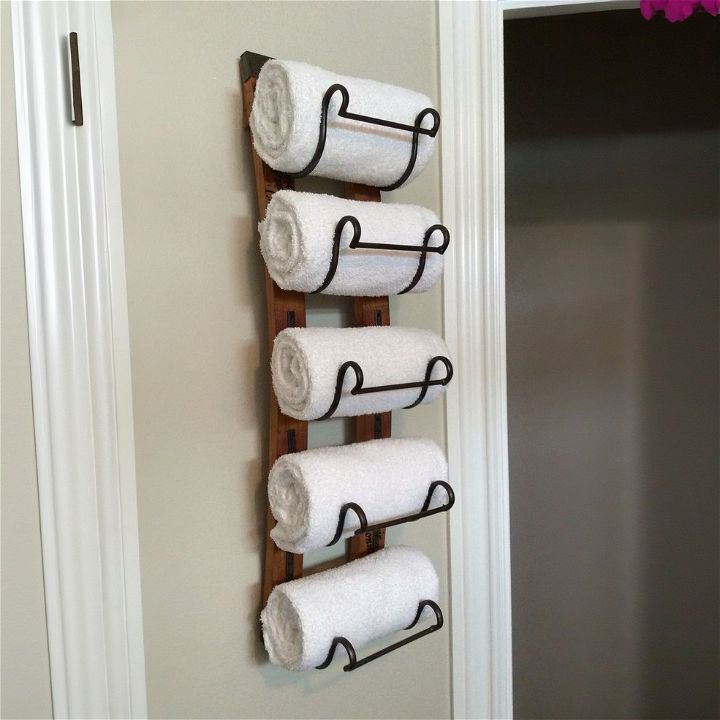 repurposed wine rack for towel storage idea