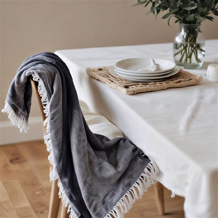 throw blanket draped over dining table chair