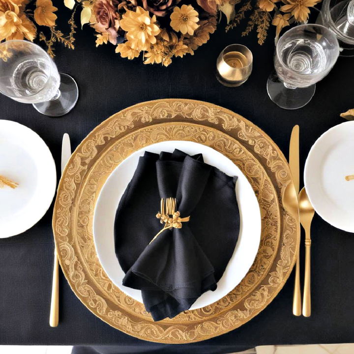 black tablecloths with gold placemats