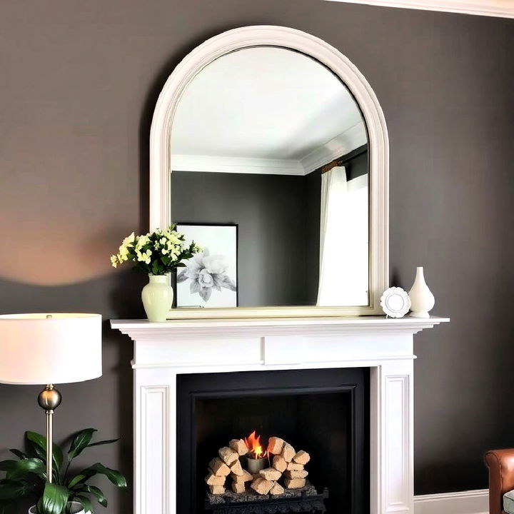 arched mirror above the fireplace