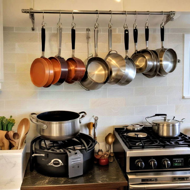 free up cabinet space with a hanging pot rail