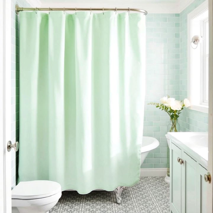 mint green shower curtain with patterned tiles