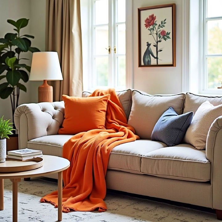 orange throw to add warmth to your living room