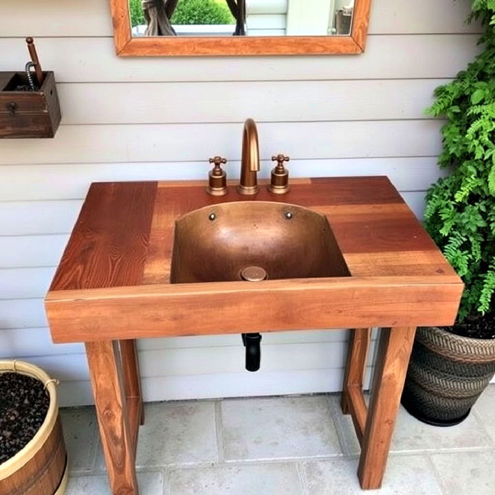 rustic repurposed wooden sink with copper fixtures