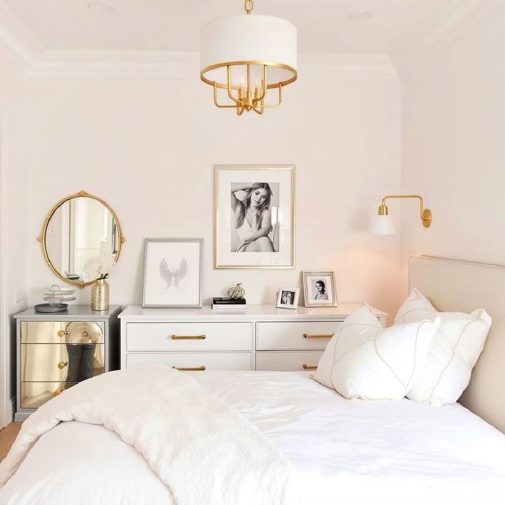 small white bedroom with metallic accents