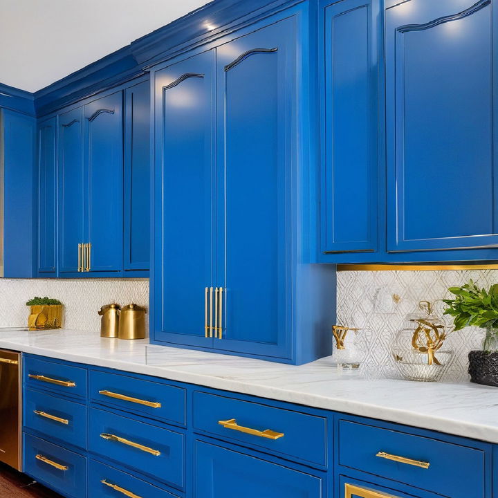 azure blue kitchen cabinets with gold ribbon pulls