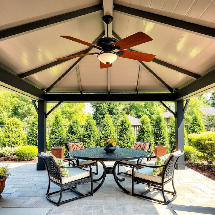 cool and breezy gazebo with a ceiling fan