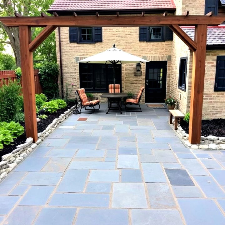 frame your bluestone patio with a rustic cobblestone border