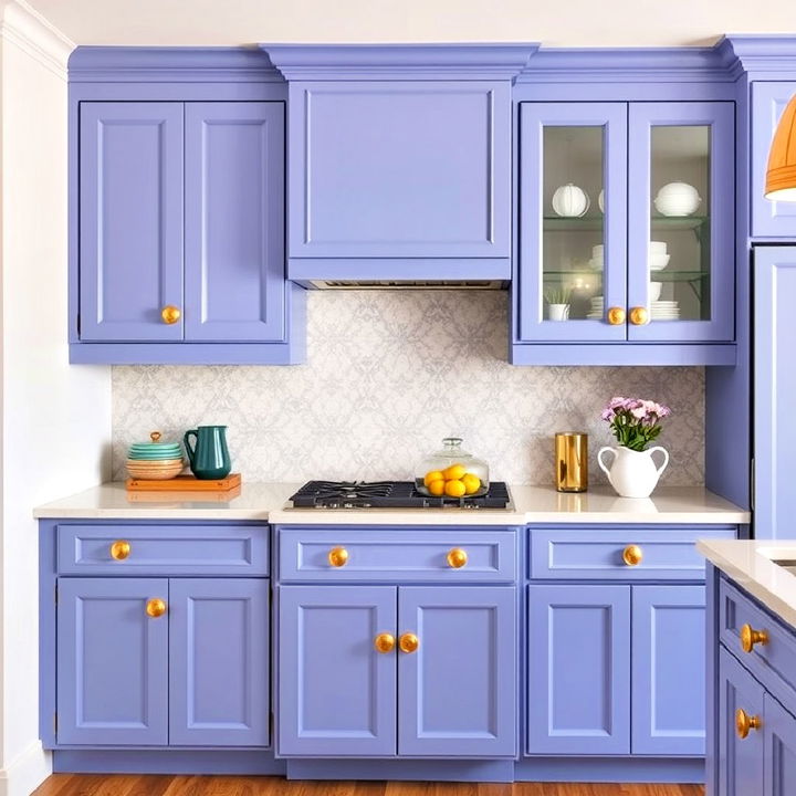 periwinkle kitchen cabinets paired with textured gold leaf knobs