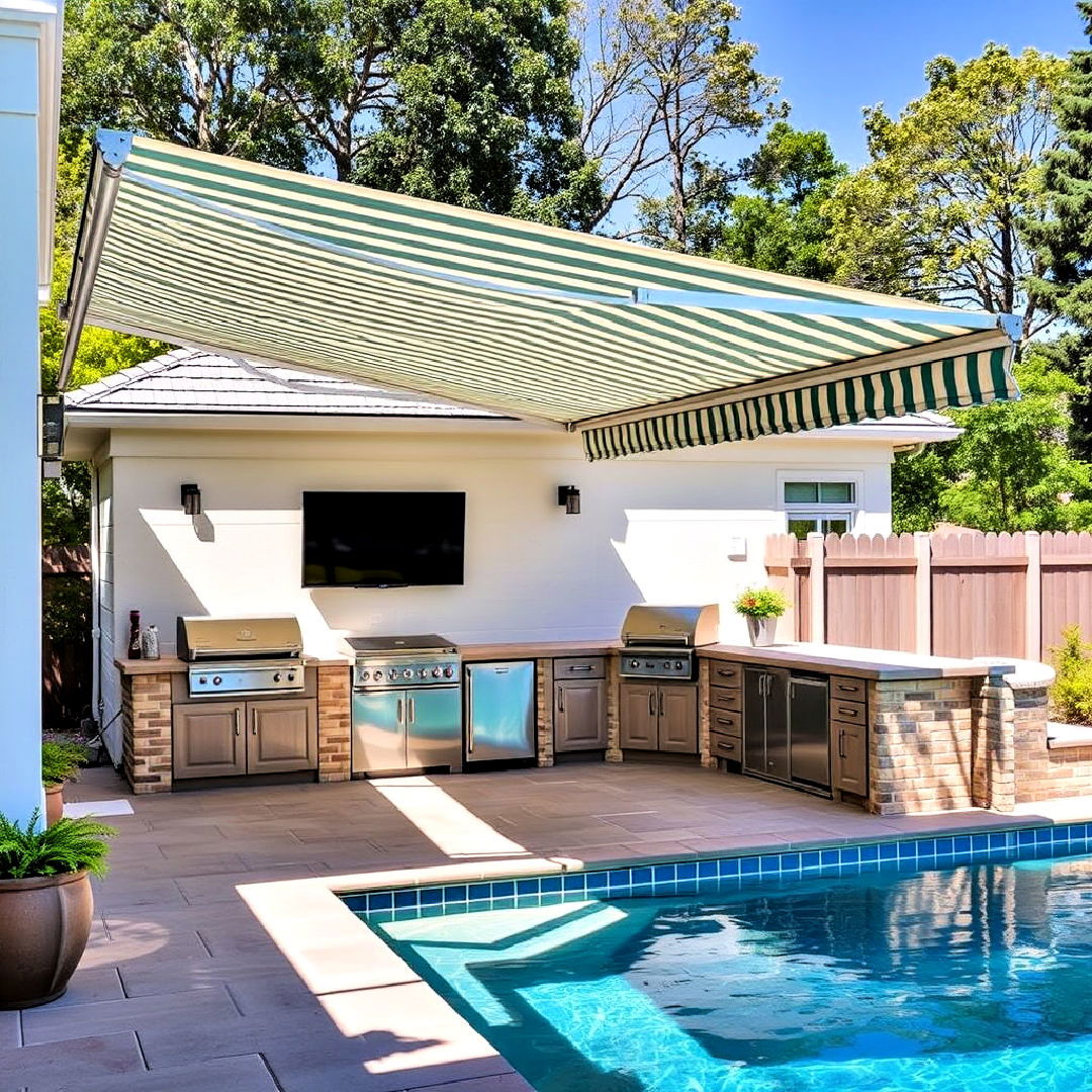 pool house with outdoor kitchen and retractable awning