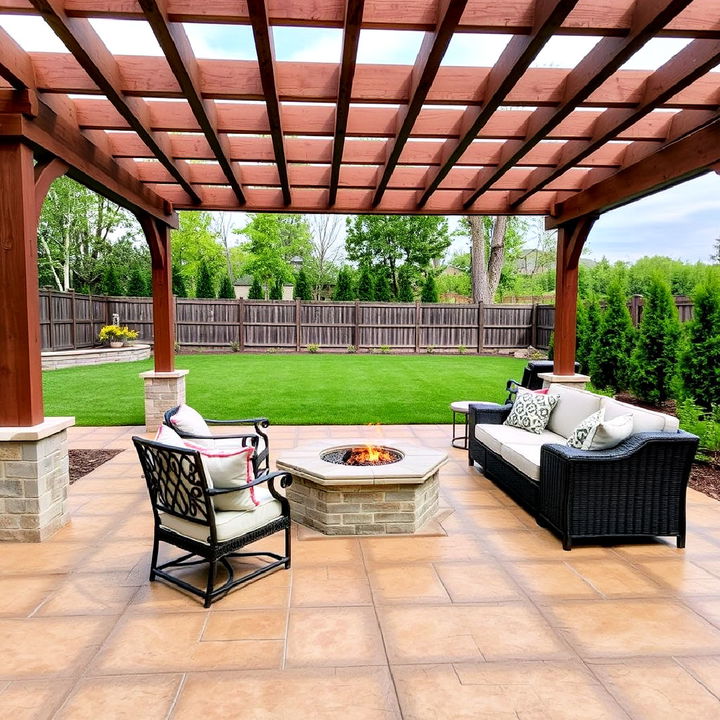 stamped concrete patio with fire pit and pergola retreat