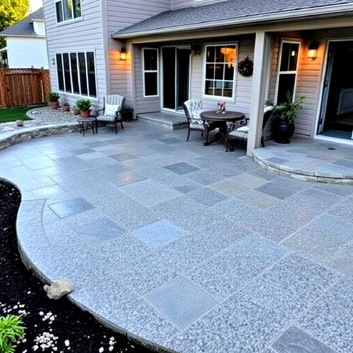 unique stamped concrete patio with pebble texture finish