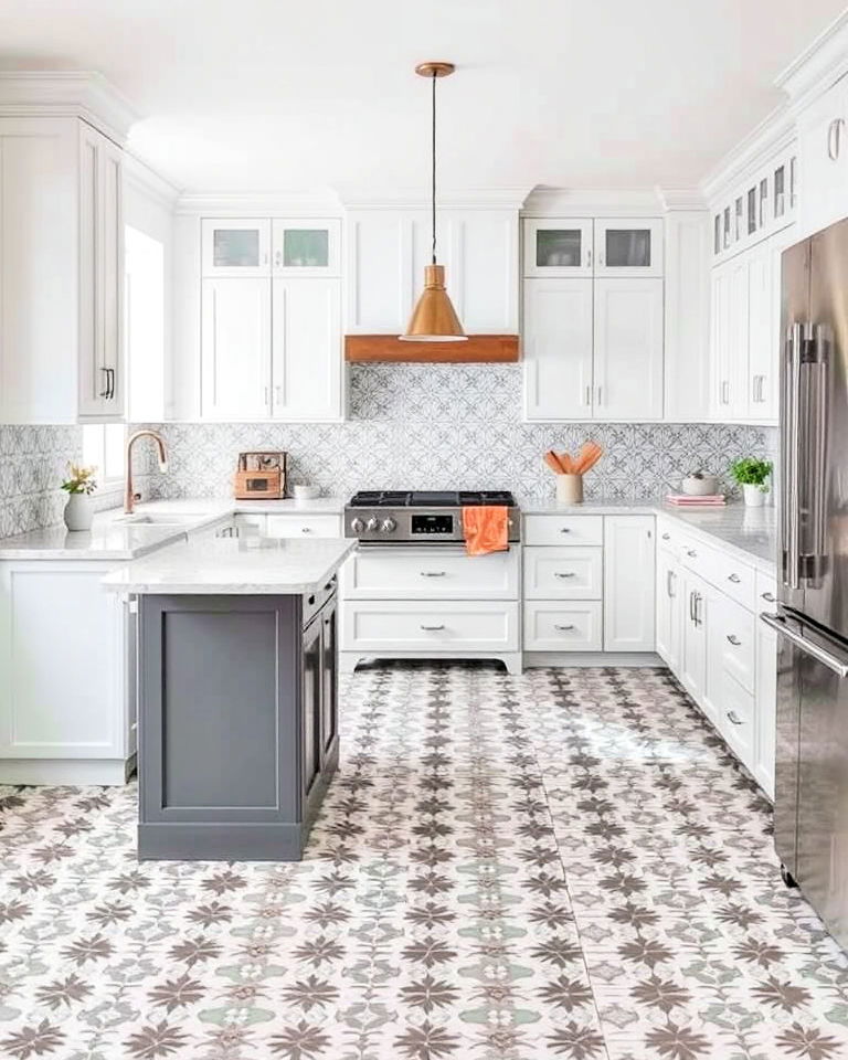 white cabinets with grey island and patterned tile floor