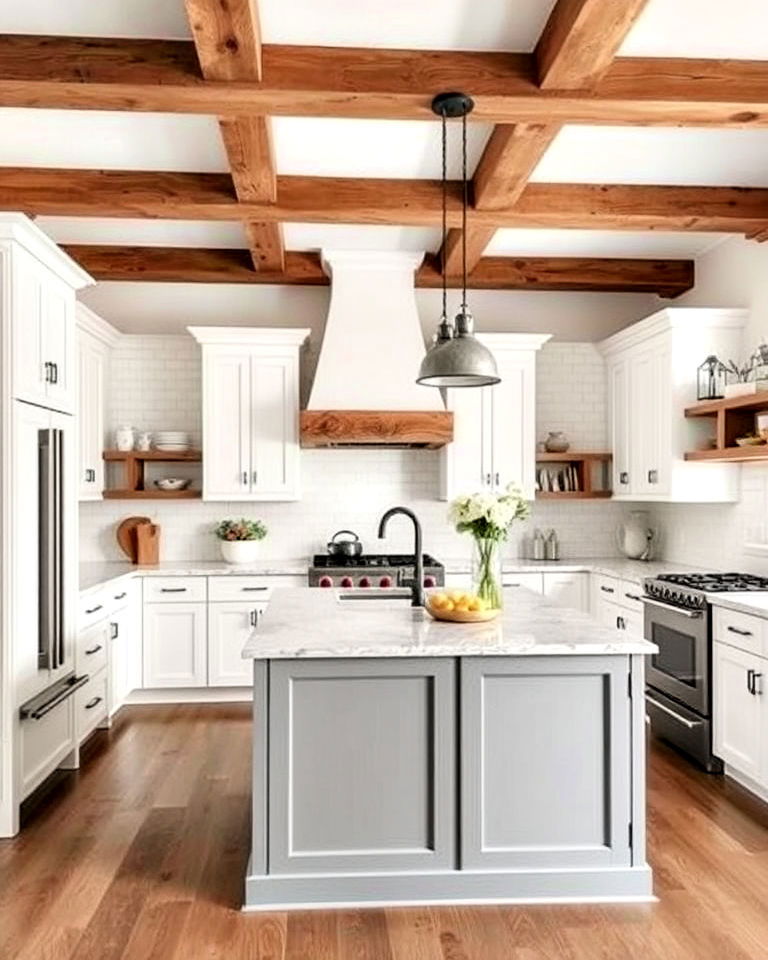 white cabinets with grey island and wooden beams